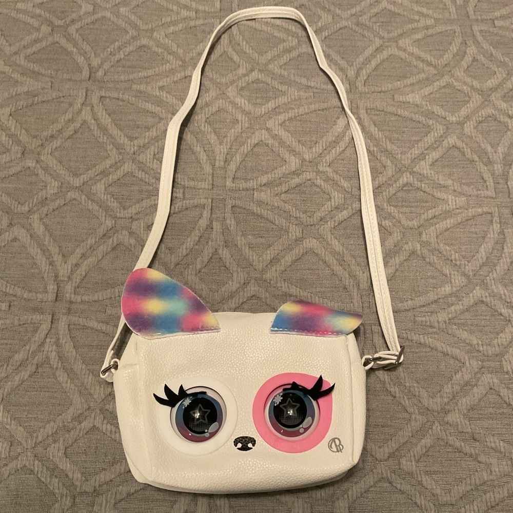 Purse Pets Rainbow Pup
Measures 4.25in H x 6.25in W x 2.5in D